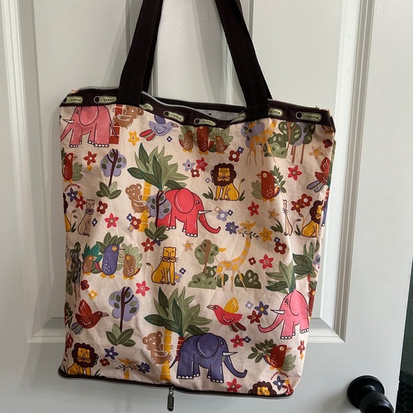 Lesportsac Handbags - Vintage LeSportsac Colorful Animal Print Tote Bag. Top zipper needs replacing.
